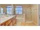 Bathroom featuring double sinks, soaking tub, and glass shower at 917 Collingtree St, Las Vegas, NV 89145