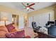 Bedroom featuring a ceiling fan, large closets, and access to an ensuite bathroom at 917 Collingtree St, Las Vegas, NV 89145