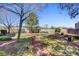 Community common area with a walking path, shade trees, and benches for relaxing at 917 Collingtree St, Las Vegas, NV 89145