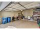 Spacious garage with ample storage space, shelving, and work area at 917 Collingtree St, Las Vegas, NV 89145