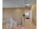 Bright hallway leads to a bedroom, featuring carpet flooring and neutral wall tones at 917 Collingtree St, Las Vegas, NV 89145