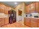 Kitchen featuring wood cabinetry and stainless steel refrigerator at 917 Collingtree St, Las Vegas, NV 89145