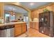 Bright kitchen with tile countertops, stainless steel appliances, and wood floors at 917 Collingtree St, Las Vegas, NV 89145