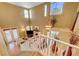 A bright two-story living room and staircase featuring an elegant chandelier at 917 Collingtree St, Las Vegas, NV 89145