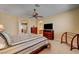 Cozy bedroom featuring neutral carpet, ceiling fan, and ensuite bathroom at 917 Collingtree St, Las Vegas, NV 89145