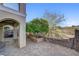 Charming patio area featuring custom brick pavers, lovely landscaping, and partial covering from upper level at 917 Collingtree St, Las Vegas, NV 89145