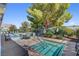 Inviting community pool with jacuzzi and lounging chairs at 917 Collingtree St, Las Vegas, NV 89145