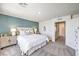 This bedroom features stylish decor, with a mix of white and teal accents at 9355 Jade Mesa St # 52, Las Vegas, NV 89139