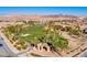 Breathtaking aerial view of the community's golf course with mountain views at 1009 Via Canale Dr, Henderson, NV 89011