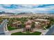 Expansive aerial view of the community featuring lush landscaping, pools and mountain views at 1009 Via Canale Dr, Henderson, NV 89011