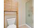 Bathroom with a white toilet and a shower behind a frosted glass door at 1009 Via Canale Dr, Henderson, NV 89011