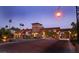 Elegant community entrance with stone accents, lush landscaping, and warm lighting at 1009 Via Canale Dr, Henderson, NV 89011
