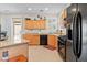 Charming kitchen with wooden cabinets and access to the backyard at 1009 Via Canale Dr, Henderson, NV 89011