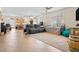 Open living room area featuring neutral walls, tile flooring, an area rug, and a comfortable sofa at 1009 Via Canale Dr, Henderson, NV 89011