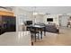 Open-concept living room with tile flooring and dining area at 1009 Via Canale Dr, Henderson, NV 89011