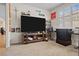 Living area with a tv, seating, and open access to the kitchen and dining room at 1009 Via Canale Dr, Henderson, NV 89011