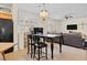 Wide open living room area combined with a breakfast table and chairs and tile flooring at 1009 Via Canale Dr, Henderson, NV 89011
