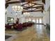 Bright lobby showcases vaulted ceilings with beams, elegant light fixtures, and comfortable seating area at 1009 Via Canale Dr, Henderson, NV 89011