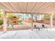 Inviting backyard with pergola, play structure, and ample space for outdoor enjoyment and entertaining at 10332 George Hart Ct, Las Vegas, NV 89129