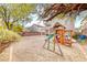 Spacious backyard featuring a play set, perfect for outdoor fun and relaxation at 10332 George Hart Ct, Las Vegas, NV 89129