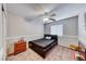 Charming bedroom with a ceiling fan, a dresser, and a comfortable bed; perfect for relaxation at 10332 George Hart Ct, Las Vegas, NV 89129
