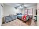 Comfortable bedroom featuring a ceiling fan, grey dresser, and a cozy bed, perfect for relaxation at 10332 George Hart Ct, Las Vegas, NV 89129