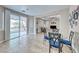 Dining area with backyard access, tile flooring, and backyard view at 10332 George Hart Ct, Las Vegas, NV 89129