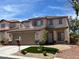 Charming two-story home featuring a well-manicured front yard, a two car garage and a welcoming entrance at 10332 George Hart Ct, Las Vegas, NV 89129