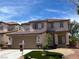 Charming two-story home featuring a well-manicured front yard, a two car garage and a welcoming entrance at 10332 George Hart Ct, Las Vegas, NV 89129