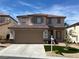 Charming two-story home featuring a well-manicured front yard, a two car garage and a welcoming entrance at 10332 George Hart Ct, Las Vegas, NV 89129
