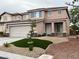 Charming two-story home with a two-car garage and low-maintenance front yard at 10332 George Hart Ct, Las Vegas, NV 89129
