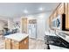 Modern kitchen offering ample counter space, stainless appliances, and tile floors at 10332 George Hart Ct, Las Vegas, NV 89129