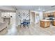 Spacious eat-in kitchen featuring tile floors, stainless appliances, and a center island with seating at 10332 George Hart Ct, Las Vegas, NV 89129