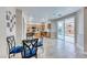 Eat-in kitchen features wood cabinets, an island, stainless appliances and sliding glass doors to the backyard at 10332 George Hart Ct, Las Vegas, NV 89129