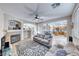 Comfortable living room featuring a fireplace, neutral tones, and tile flooring at 10332 George Hart Ct, Las Vegas, NV 89129