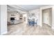 Open floorplan with tile flooring, view of the living room and an adjacent dining area at 10332 George Hart Ct, Las Vegas, NV 89129