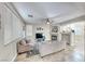 Inviting living room with large windows, fireplace, and neutral color scheme at 10332 George Hart Ct, Las Vegas, NV 89129