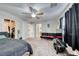 Spacious main bedroom featuring a ceiling fan, closet and ample space for relaxation at 10332 George Hart Ct, Las Vegas, NV 89129