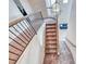 Staircase with a railing and a decorative chandelier at 10332 George Hart Ct, Las Vegas, NV 89129