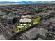 An aerial view showcases the private backyard oasis, sparkling pool, and mature landscaping at 11504 White Cliffs Ave, Las Vegas, NV 89138