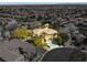 An aerial view of a well-landscaped home with a circular drive, three-car garage and swimming pool at 11504 White Cliffs Ave, Las Vegas, NV 89138