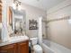 Neutral-toned bathroom featuring a bathtub and framed mirror, providing a serene space at 11504 White Cliffs Ave, Las Vegas, NV 89138