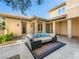 Outdoor patio with a plush lounge set and well-manicured landscaping, perfect for relaxation at 11504 White Cliffs Ave, Las Vegas, NV 89138