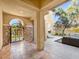 Inviting courtyard with stone accents, fireplace, and comfortable seating area at 11504 White Cliffs Ave, Las Vegas, NV 89138