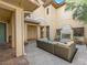 Charming outdoor space featuring a stone fireplace, complemented by comfortable patio furniture at 11504 White Cliffs Ave, Las Vegas, NV 89138