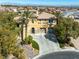 Stunning two-story home features a circular driveway, three-car garage, and mature landscaping at 11504 White Cliffs Ave, Las Vegas, NV 89138
