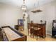 Entertaining game room complete with a bar, shuffleboard table, and game machines at 11504 White Cliffs Ave, Las Vegas, NV 89138