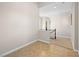 Upper level hallway with carpet and tile flooring, and a partial banister at 11504 White Cliffs Ave, Las Vegas, NV 89138