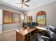 Bright home office with wood shutters, ample natural light and a spacious desk at 11504 White Cliffs Ave, Las Vegas, NV 89138