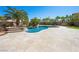 View of the freeform pool with attached spa and rock waterfall feature and gazebo at 11504 White Cliffs Ave, Las Vegas, NV 89138